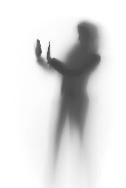istock Diffuse silhouette of a slim lady, behind glass surface 179361812