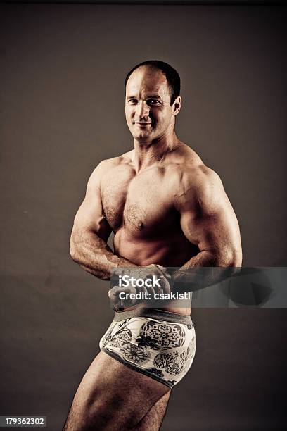 Bodybuilder Posing Stock Photo - Download Image Now - Flexing Muscles, Overweight, Adult