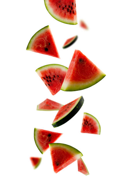 istock Pieces of watermelon fall in space. Isolated on white 1793625984