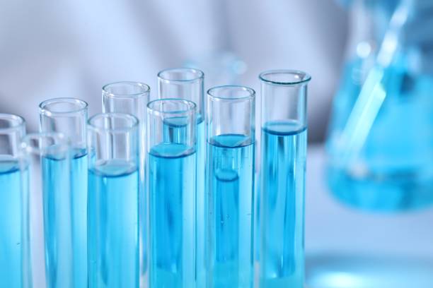 istock Test tubes with light blue liquid in laboratory, closeup 1793629779