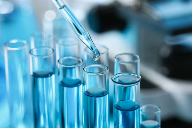 istock Dripping liquid from pipette into test tube in laboratory, closeup 1793630323