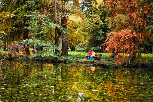 Autumn in Europe - Mother and Daughter Enjoying Nature in the Park