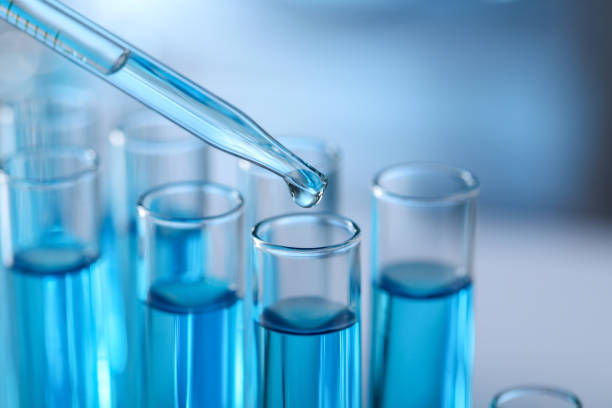 istock Dripping liquid from pipette into test tube in laboratory, closeup 1793630917