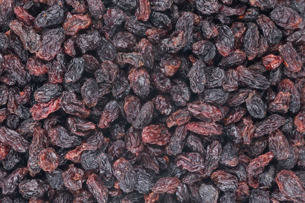 istock Background of big raw dried raisins, situated arbitrarily 1793637893