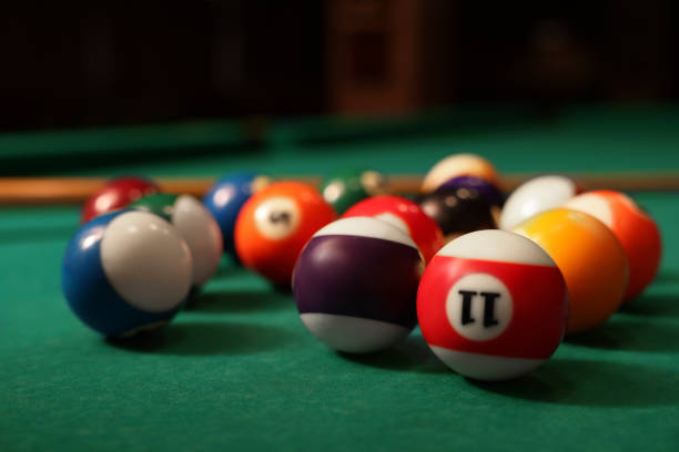 istock Many colorful billiard balls on green table, closeup 1793639578