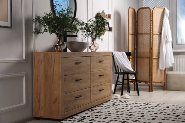 istock Modern bathroom interior with stylish mirror, eucalyptus branches, vessel sink and wooden vanity 1793641736
