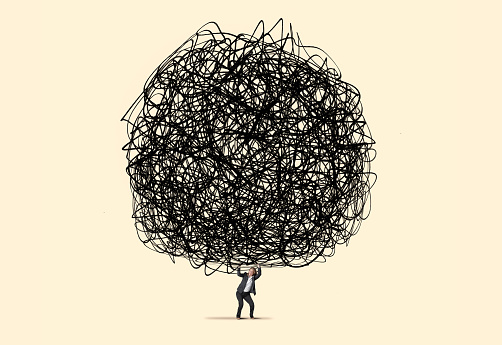 A woman carries a large burden as represented by a large round tangled mess above her isolated on a yellow background.