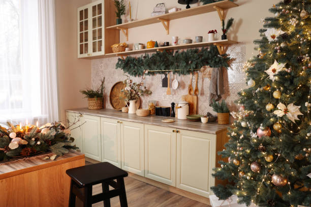 istock Stylish kitchen with festive decor and Christmas tree. Interior design 1793664698