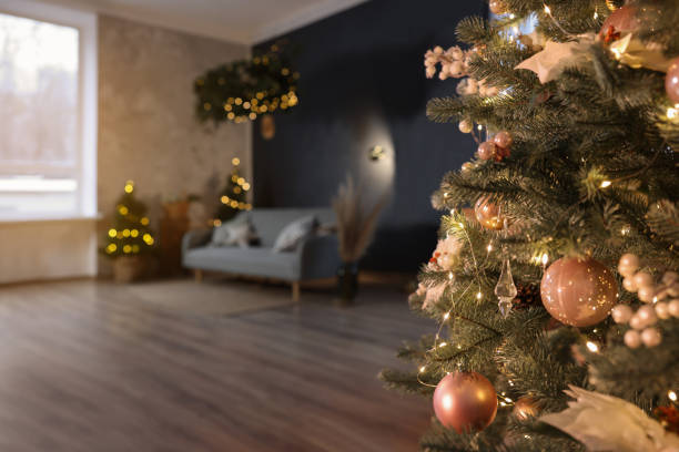 istock Stylish living room with comfortable sofa and Christmas tree, closeup. Interior design 1793668121