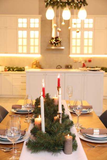 istock Festive table setting and beautiful Christmas decor in kitchen. Interior design 1793668655
