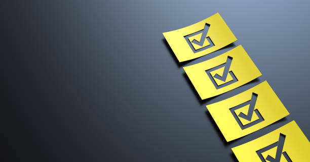 istock ''Checklist''yellow paper on black background 1793672372