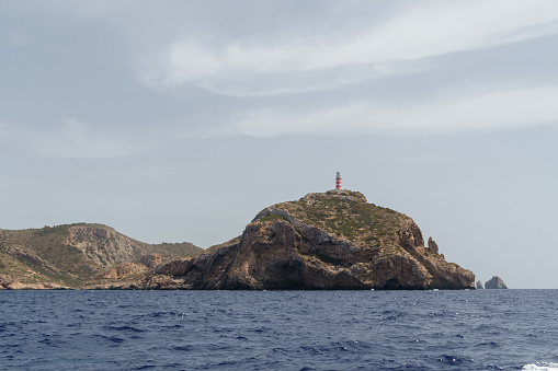 Cabrera Archipelago Maritime-Terrestrial National Park, Spain-August 2022:The Cabrera Archipelago Maritime-Terrestrial National Park is a national park that includes the whole of the Cabrera Archipelago in the Balearic Islands, an autonomous community that is part of Spain. The park is the largest in Spain, covering 908 square kilometres (351 sq mi) including 895 square kilometres (346 sq mi) of sea area.The archipelago has great natural value. Due to its isolation throughout history, it has remained relatively unchanged. The coastal landscape of Cabrera is often considered one of the best preserved on the Spanish coast