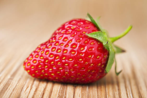 istock Fresh red strawberries on wooden table 179368154