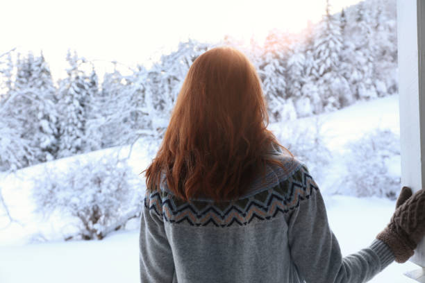 istock Woman on snowy day outdoors, back view. Winter vacation 1793704565
