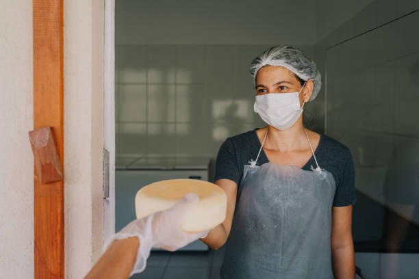 istock Woman delivering canasta cheese 1793747473