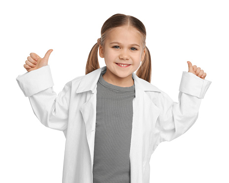 Little girl in medical uniform showing thumbs up on white background