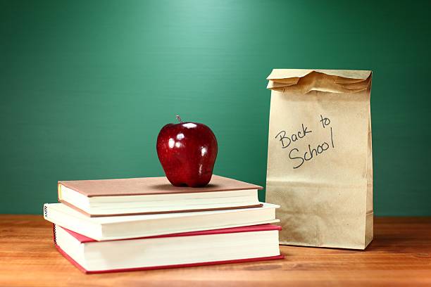 istock Books, Apple and Lunch on Teacher Desk With Space 179376807