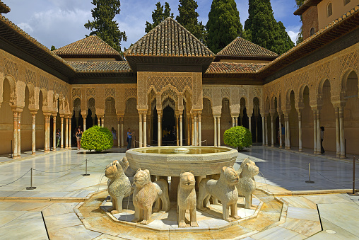 The Alhambra of Granada, the main landmark of Granada and one of the most famous monuments of Islamic architecture in the world. Behind rise up the snow-capped mountains of the Sierra Nevada.