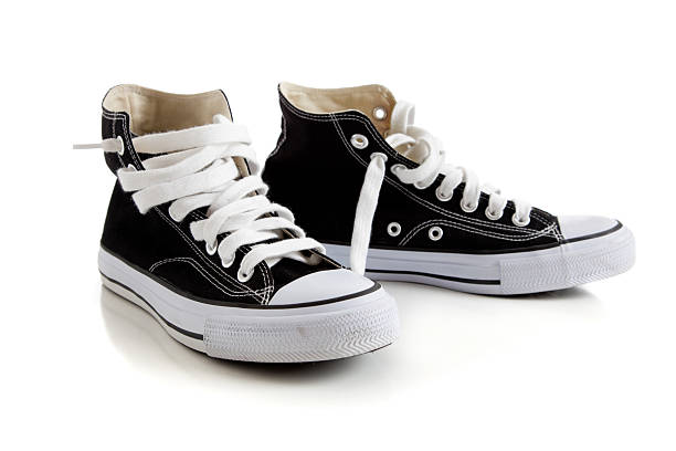istock Black high top sneakers on white 179378686