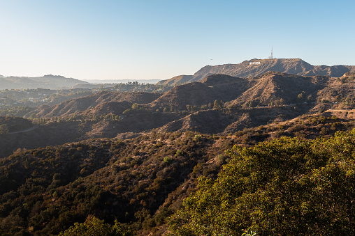 Photo of the iconic Hollywood sign in the distance, which overlooking Los Angeles, California