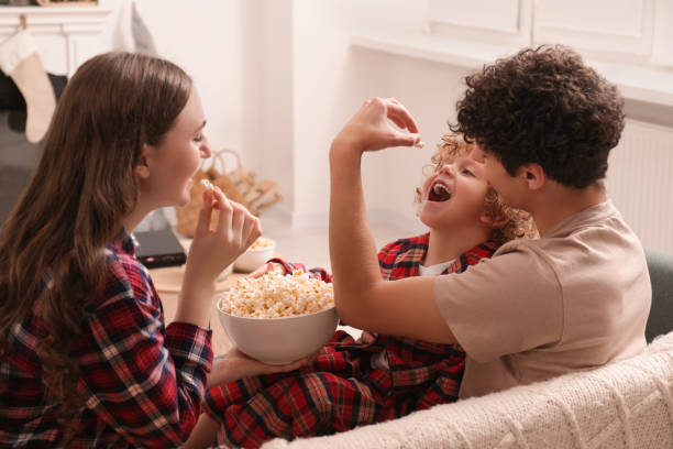 istock Family spending time together at home. Eating popcorn 1793833069