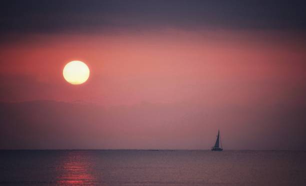 istock Mediterranean sunrise with nice sailboat 1793845313