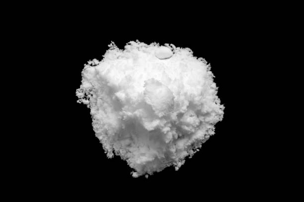 istock White snow isolated on black background close up 1793854997