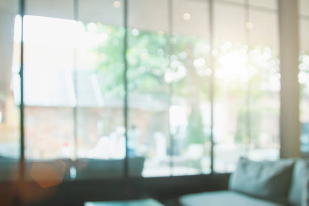 istock Abstract blur interior coffee shop or cafe for background. Blur restaurant interior banner background. Coffee shop blur background with bokeh. Blurred windows green garden background. 1793858455