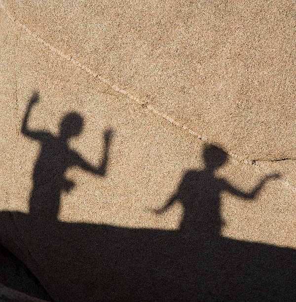 istock shadow game of children with hands 179386282