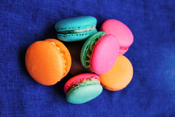 A close-up of tasty colorful cookies on a blue background