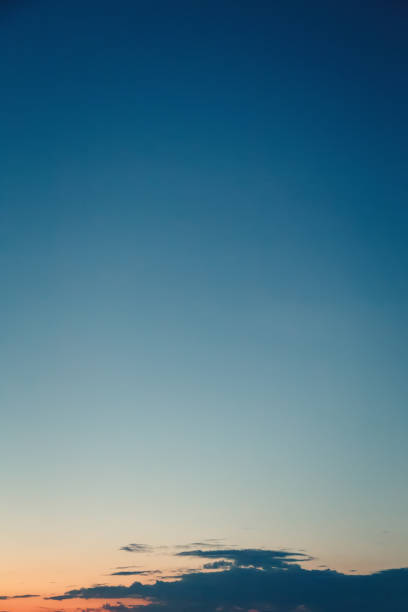 istock Gradient from blue to orange on sunrise sky 1793867903