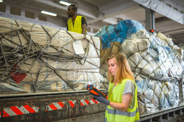 istock Diverse Airport Warehouse Coworkers Moving Cargo 1793893294