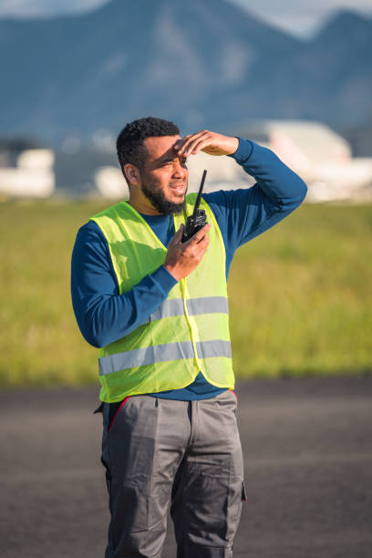 istock Hispanic Airfield Operations Observing A Situation On A Runway 1793894926