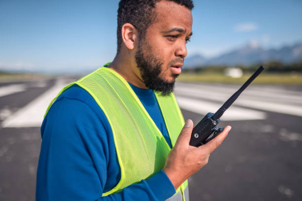 istock Hispanic Airfield Operations Observing A Situation On A Runway 1793895446