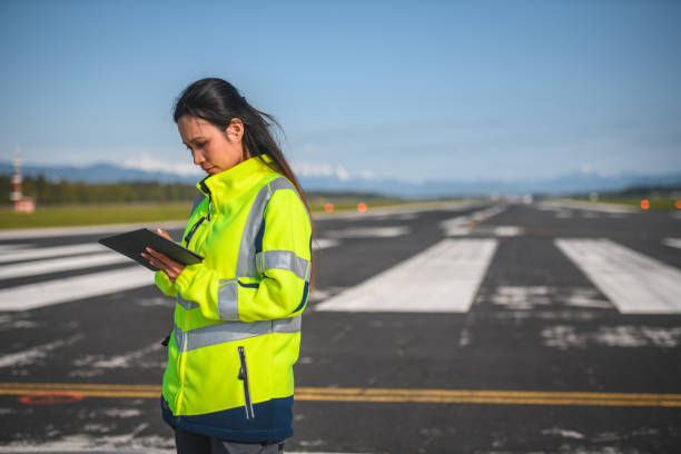 istock Asian Female Airfield Operations Officer Using A Digital Tablet 1793895458