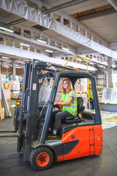 istock Caucasian Female Airport Warehouse Forklift Operator 1793896496