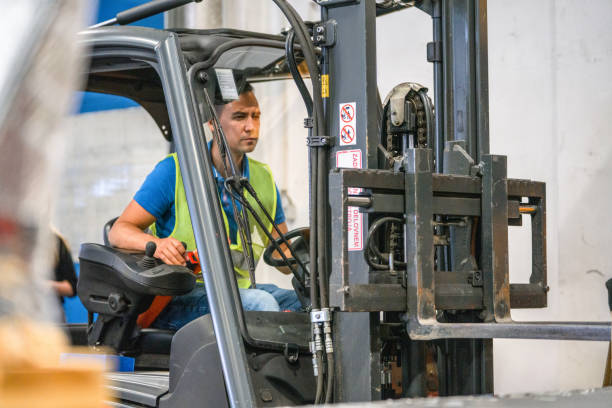istock Asian Airport Warehouse Worker On A Forklift 1793896499
