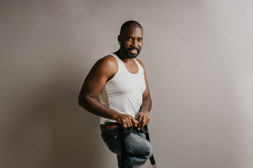 Black man with amputated leg in studio