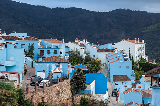 Júzcar, Spain - 3rd November 2023: Part of the Blue Village of Júzcar; in the Serranía de Ronda, Andalucía, Spain. Formerly one of Andalucía's White Villages, it was painted blue by Sony to promote their movie The Smurfs in 2011. A subsequent village ballot voted  to retain the blue colouring.