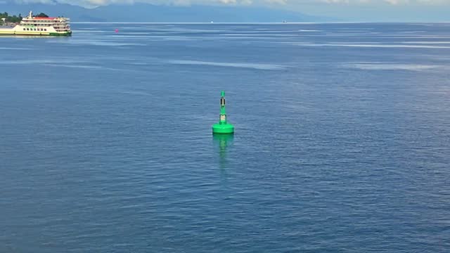Aerial point of interest of marine navigation buoy in the Surigao Strait, Philippines