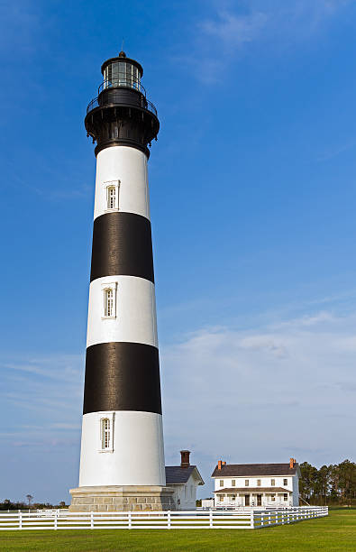 Bodie Island Lighthouse The black and white striped Bodie Island Lighthouse stands in Cape Hatteras National Seashore on North Carolina's Outer Banks. bodie island stock pictures, royalty-free photos & images