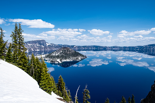 Wizard Island is a volcanic cinder cone in Crater Lake, a National Park in Oregon, taken May 25, 2023. The lake itself is a volcanic caldera.