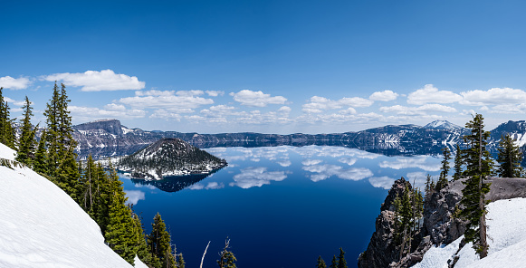Pano of Crater Lake, a National Park in Oregon, taken May 25, 2023. The lake is a volcanic caldera; Wizard Island is cinder cone.
