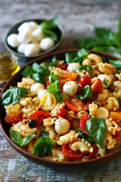 istock Pasta with basil, mozzarella and vegetables. Close-up. 1793962634