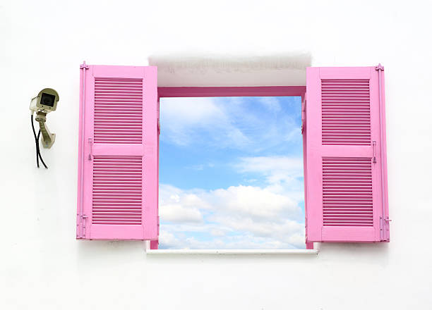 istock Greek style windows with cctv and blue sky 179397054