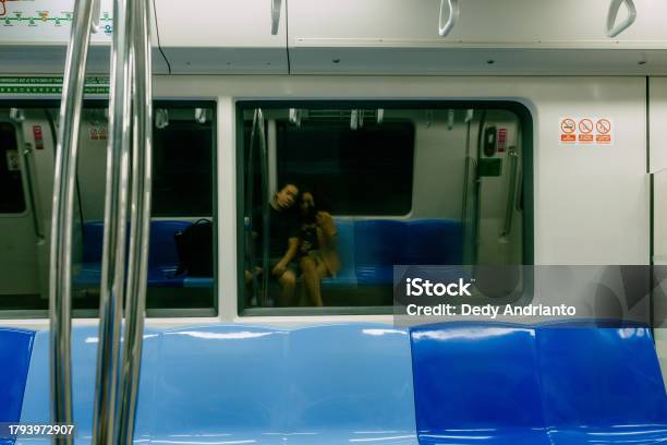 Asian Couple Taking Selfie In Empty Mrt Train Stock Photo - Download Image Now - Lifestyles, Singapore, 25-29 Years