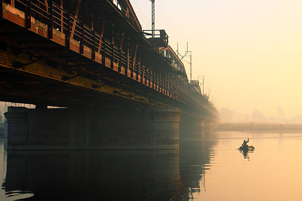istock Boat on River and a Old Iron Bridge 179397812