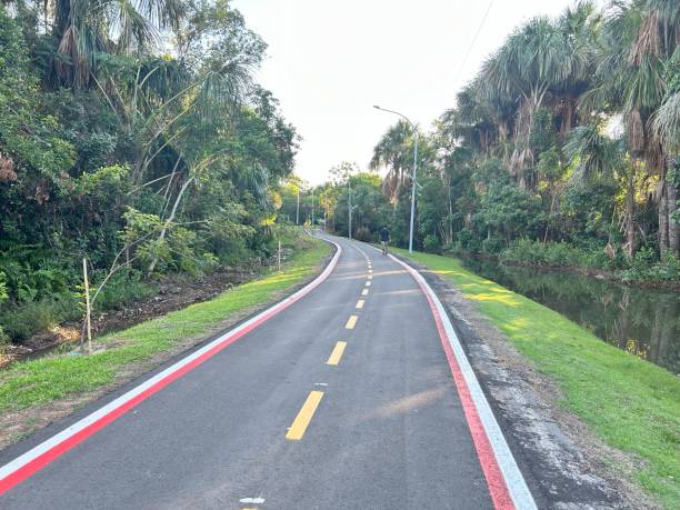 istock beautifull park runway road with lake 1793989010