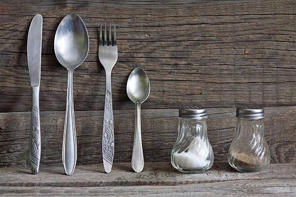 istock Cutlery kitchenware on old wooden boards 179402824