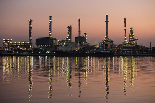 istock Petroleum oil refinery beside the river at night 179403262